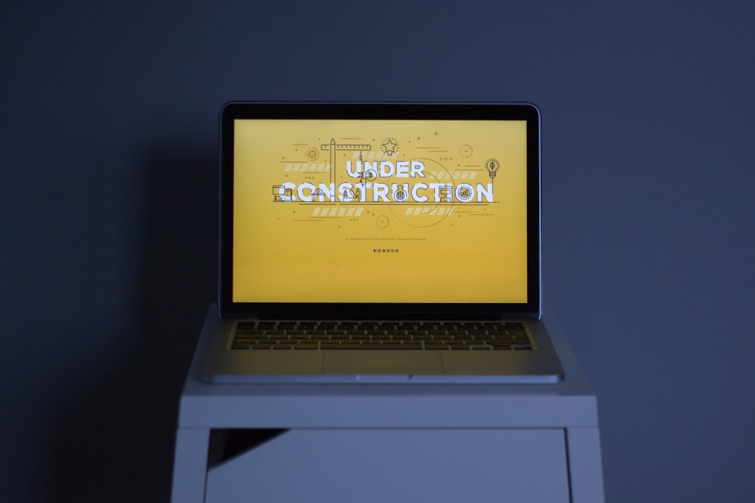Contractor website and enquiry route being reviewed on a laptop